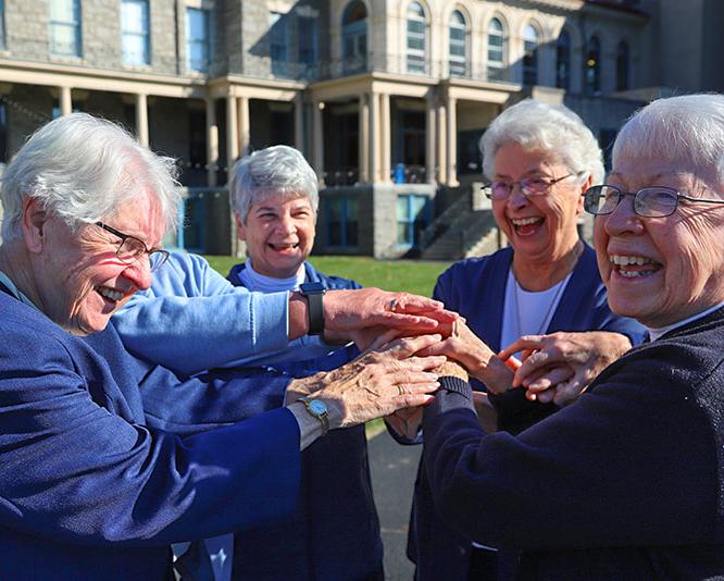 Group of IHM sisters on college campus